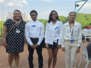 students standing outside smiling